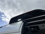 Ford E-Transit 350 L3H2 Trend 68 kWh Kastinrichting Werkplaatsinrichting Airco Cruise controle 360° Camera Navigatiesysteem Telefoonverbinding Parkeersensoren voor en achter 2-Persoons Oplaadkabels Stoelverwarming Bottinrichting