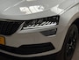 Skoda Karoq 1.5 TSI ACT Deluxe 150Pk Automaat (PANORAMADAK, APPLE CARPLAY, LEDER, ZWART HEMEL, CANTON AUDIO, STOELVERWARMING, ADAPTIVE CRUISE, KEYLESS, GETINT GLAS, CAMERA, NIEUWSTAAT)