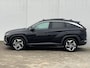 Hyundai Tucson 1.6 T-GDI HEV Premium Sky / Schuif - kanteldak / Afn. trekhaak / Lederen interieur / Navigatie / Verwarmde + gekoelde stoelen + memory / 19 inch LMV.
