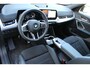 BMW X1 sDrive18i | Panorama dak | Elektrisch wegklapbare trekhaak | Stoelverwarming | Achteruitrijcamera | Elektrische kofferbakklep | Keyless entry/start | Half leder/alcantara | Draadloze telefoonlader | Apple CarPlay/Android Auto | Navigatie | Climate controle | Parkeersensoren V+A |