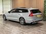 Volvo V60 T6 AWD Recharge Ultra Dark | Trekhaak | Schuifdak | Head-Up Display | Harman Kardon | Adaptieve Cruise Control | Stoelverwarming voor+achter | Stuurwielverwarming | Full LED Meesturende koplampen | Parkeercamera | Pilot Assist | BLIS Dode Hoek Detectie | Elektrische voorstoelen geheugen | Lederen bekleding | Zitting verlenging voorstoelen | Lederen dashboard | Google Infotainment | Keyless Drive | Parkeersensoren voor+achter | Privacy Glass | Elektrisch bedienbare achterklep | DAB Radio | Apple Carplay/Android Auto | Volvo On Call met mobiele App functie | Vapour Grey Metallic |