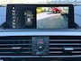 BMW 1-Serie 118I High Executive Automaat Navi Camera Leer Trekhaak