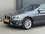 BMW 1-Serie 118i/136pk Essential|2015|Automaat|NAP|H&K|Leder|Clima|Zwarte hemel|16" LMV