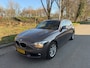 BMW 1-Serie 118i 5Drs Airco Navigatie Automaat Bruin