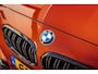 BMW 1-Serie M135i xDrive|Schuifdak|Memory|Valencia Orange|Keyless|M-performance remmerij