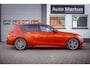 BMW 1-Serie M135i xDrive|Schuifdak|Memory|Valencia Orange|Keyless|M-performance remmerij