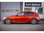 BMW 1-Serie M135i xDrive|Schuifdak|Memory|Valencia Orange|Keyless|M-performance remmerij
