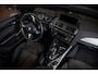 BMW 1-Serie M135i xDrive|Schuifdak|Memory|Valencia Orange|Keyless|M-performance remmerij