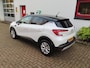 Renault Captur TCe 140pk Mild Hybrid EDC Intens/ Parelmoer wit/ Trekhaak/ Stoel + stuurwiel verwarming/ Camera/ Apple Carplay/ DAB/ Cruise control/ Climatronic
