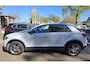 Volkswagen T-Roc 1.0 TSI Style Business metallic grijs. o.a. carplay, stoelverwarming, navi, pdc. Zeer netjes.