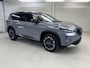 Nissan X-Trail 1.5 e-4orce Tekna 4WD 5p / 1800 KG Trekgewicht / Lederen Bekleding / Memoryseats / Navigatie / 360 Graden Camera / Stoel- en Stuurverwarming / Achterbankverwarming / Verwarmde Voorruit / Adaptive Cruise Control / Digitale Binnenspiegel / Climate Control /