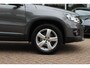 Volkswagen Tiguan 2.0 TSI Sport&Style 4Motion / Trekhaak / Android Auto / Parkeerhulp V+A / 17'' / Xenon / DAB / Navigatie / Stoelverwarming / Cruise Control