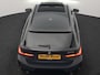 BMW 3-Serie Touring 330e M Sport PHEV 293pk Dealer O.H. | Dravitgrau | Trekhaak Af Fabriek | Panodak | Head Up | Camera | Lederen Sportstoelen Verwarmd | Sfeerverlichting | Apple Carplay | Keyless | Blis | Cruise Control | Navigatie | DAB | Plug I