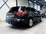 Ford Focus Wagon EcoBoost 125 pk Titanium | Trekhaak | Voorruitverw. | Navi | Clima | Cruise | 17" | Keyless entry