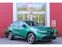 Alfa Romeo Tonale 1.5T Hybrid 160PK VELOCE | PREMIUM PACK: LEDEREN BEKLEDING/GEVENTILEERDE VOORSTOELEN/4-VOUDIG ELEKTRISCH VERSTELBARE LENDESTEUN VOORSTOELEN/ELEKTRISCH BEDIENBARE /HOOGGLANS ZWARTE RAAMOMLIJSTING/AMBIENT LIGHTING | TECHNOLOGY PACK: PARKEERWAARSCHUWING VOOR EN ACHTER/360° CAMERA/AUTOMATISCH INPARKEREN/ AUTONOMOUS DRIVING LEVEL 2: ADAPTIVE CRUISE CONTROL/LANE CENTERING ASSIST/TRAFFIC JAM ASSIST DODEHOEK DETECTIE AUTOMATISCH DIMMENDE BUITENSPIEGELS ELEKTRISCH BEDIENBARE ACHTERKLEP | WINTERPACK: STOELVERWARMING VOOR/STUURVERWARMING/VERWARMBARE RUITENSPROEIERS | 19" LICHTMETALEN VELGEN | DRAADLOZE TELEFOONLADER | NAVIGATIE | DRAADLOZE APPLE CARPLAY/ANDROID AUTO | FULL LED MATRIX KOPLAMPEN |
