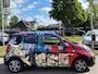 Kia Picanto 1.0 VVTI beschilderd door Selwyn Senatori