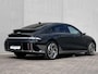 Hyundai Ioniq 6 Lounge AWD 325 pk 77.4 kWh / Fabrieksgarantie tot 5-2029 / tot 05-2032 Batterijgarantie / SoH accu 100 % / Dealer onderhouden / Camera spiegels / Schuifdak / Elektrische stoelen en klep / Leder / Camera 360° / BOSE / Adapt. CC / Stuur-, stoel- & achterbankverwarming / Stoelventilatie / 20" LM wielen /
