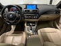 BMW 1-Serie 118i High Executive (PANO, LED, STOELVERWARMING, GROOT NAVI, PARKEERSENSOREN)
