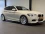 BMW 1-Serie 118i High Executive (PANO, LED, STOELVERWARMING, GROOT NAVI, PARKEERSENSOREN)
