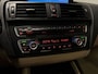 BMW 1-Serie 118i High Executive (PANO, LED, STOELVERWARMING, GROOT NAVI, PARKEERSENSOREN)
