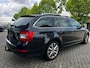 Skoda Octavia Combi 1.6 TDI Ambition Businessline (Automaat, Stoelverwarming, Panoramadak, Parkeersensoren, NL-auto)
