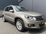 Volkswagen Tiguan 1.4 TSI R-Line Edition Airco - Apple carplay - Achteruitrijcamera - Parkeersensoren - Navigatie - Cruise control - Trekhaak - Dakrails - Led verlichting - Dakspoiler - Licht metalen velgen 18 inch - Stuur multifun - Start/stop systeem - Radio - Bluetooth - mistlampen voor
