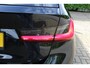 BMW 3-Serie Touring 318i High Executive | Incl. 12 maanden garantie | Trekhaak elektrisch uitklapbaar | Harman/Kardon audio | Apple Carplay/Android Auto | Sport stoelen | DAB | Voorstoelen verwarmd | Elektrische achterklep | Cruise control adaptief |
