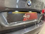 BMW 5-Serie Touring 520d High Exe PANO/LED/TREKHAAK/ZWART LEER/18"/NAVI-GROOT/ECC/CRUISE/STOELVERWARMING/PRIVACY/MINERALGRAU/PERFECT ONDERHOUDEN MET VOLLEDIGE HISTORIE/EURO 6