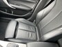 BMW 1-Serie 118i High Executive M Sport Shadow / Cruise Control / M-stuur / Apple Carplay&Android Auto / Led Koplampen / Electronic Climate Control / Voorstoelen Verwarmd / Navigatie / Parkeersensoren Voor&Achter / Hifi Speakers