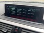 BMW 1-Serie 118i High Executive M Sport Shadow / Cruise Control / M-stuur / Apple Carplay&Android Auto / Led Koplampen / Electronic Climate Control / Voorstoelen Verwarmd / Navigatie / Parkeersensoren Voor&Achter / Hifi Speakers