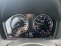 BMW 1-Serie 118i High Executive M Sport Shadow / Cruise Control / M-stuur / Apple Carplay&Android Auto / Led Koplampen / Electronic Climate Control / Voorstoelen Verwarmd / Navigatie / Parkeersensoren Voor&Achter / Hifi Speakers