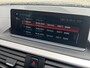BMW 1-Serie 118i High Executive M Sport Shadow / Cruise Control / M-stuur / Apple Carplay&Android Auto / Led Koplampen / Electronic Climate Control / Voorstoelen Verwarmd / Navigatie / Parkeersensoren Voor&Achter / Hifi Speakers