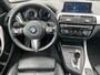 BMW 1-Serie 118i High Executive M Sport Shadow / Cruise Control / M-stuur / Apple Carplay&Android Auto / Led Koplampen / Electronic Climate Control / Voorstoelen Verwarmd / Navigatie / Parkeersensoren Voor&Achter / Hifi Speakers