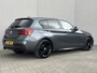 BMW 1-Serie 118i High Executive M Sport Shadow / Cruise Control / M-stuur / Apple Carplay&Android Auto / Led Koplampen / Electronic Climate Control / Voorstoelen Verwarmd / Navigatie / Parkeersensoren Voor&Achter / Hifi Speakers
