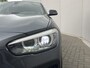 BMW 1-Serie 118i High Executive M Sport Shadow / Cruise Control / M-stuur / Apple Carplay&Android Auto / Led Koplampen / Electronic Climate Control / Voorstoelen Verwarmd / Navigatie / Parkeersensoren Voor&Achter / Hifi Speakers