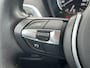 BMW 1-Serie 118i High Executive M Sport Shadow / Cruise Control / M-stuur / Apple Carplay&Android Auto / Led Koplampen / Electronic Climate Control / Voorstoelen Verwarmd / Navigatie / Parkeersensoren Voor&Achter / Hifi Speakers