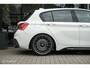 BMW 1-Serie M140i High Executive | Schuif-kanteldak | Harman Kardon | Camera | NL auto | 19 inch OZ Superturismo Aero | dealer onderhouden | Cruise
