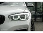 BMW 1-Serie M140i High Executive | Schuif-kanteldak | Harman Kardon | Camera | NL auto | 19 inch OZ Superturismo Aero | dealer onderhouden | Cruise