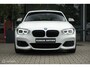 BMW 1-Serie M140i High Executive | Schuif-kanteldak | Harman Kardon | Camera | NL auto | 19 inch OZ Superturismo Aero | dealer onderhouden | Cruise