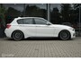 BMW 1-Serie M140i High Executive | Schuif-kanteldak | Harman Kardon | Camera | NL auto | 19 inch OZ Superturismo Aero | dealer onderhouden | Cruise