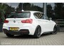 BMW 1-Serie M140i High Executive | Schuif-kanteldak | Harman Kardon | Camera | NL auto | 19 inch OZ Superturismo Aero | dealer onderhouden | Cruise