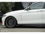 BMW 1-Serie M140i High Executive | Schuif-kanteldak | Harman Kardon | Camera | NL auto | 19 inch OZ Superturismo Aero | dealer onderhouden | Cruise