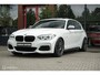 BMW 1-Serie M140i High Executive | Schuif-kanteldak | Harman Kardon | Camera | NL auto | 19 inch OZ Superturismo Aero | dealer onderhouden | Cruise