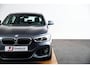 BMW 1-Serie 118i Edition M Sport Shadow High Executive Middenarmsteun - PDC Voor/achter - Cruise Control - Sportstoelen - Elektrisch verstelbare lendensteunen - Elektrisch verwarmde voorstoelen - Navigatiesysteem Business -