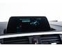 BMW 1-Serie 118i Edition M Sport Shadow High Executive Middenarmsteun - PDC Voor/achter - Cruise Control - Sportstoelen - Elektrisch verstelbare lendensteunen - Elektrisch verwarmde voorstoelen - Navigatiesysteem Business -