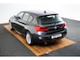 BMW 1-Serie 118i Edition M Sport Shadow High Executive Middenarmsteun - PDC Voor/achter - Cruise Control - Sportstoelen - Elektrisch verstelbare lendensteunen - Elektrisch verwarmde voorstoelen - Navigatiesysteem Business -