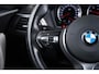 BMW 1-Serie 118i Edition M Sport Shadow High Executive Middenarmsteun - PDC Voor/achter - Cruise Control - Sportstoelen - Elektrisch verstelbare lendensteunen - Elektrisch verwarmde voorstoelen - Navigatiesysteem Business -