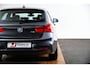 BMW 1-Serie 118i Edition M Sport Shadow High Executive Middenarmsteun - PDC Voor/achter - Cruise Control - Sportstoelen - Elektrisch verstelbare lendensteunen - Elektrisch verwarmde voorstoelen - Navigatiesysteem Business -