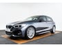 BMW 1-Serie 118i Edition M Sport Shadow High Executive Middenarmsteun - PDC Voor/achter - Cruise Control - Sportstoelen - Elektrisch verstelbare lendensteunen - Elektrisch verwarmde voorstoelen - Navigatiesysteem Business -