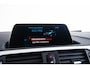 BMW 1-Serie 118i Edition M Sport Shadow High Executive Middenarmsteun - PDC Voor/achter - Cruise Control - Sportstoelen - Elektrisch verstelbare lendensteunen - Elektrisch verwarmde voorstoelen - Navigatiesysteem Business -